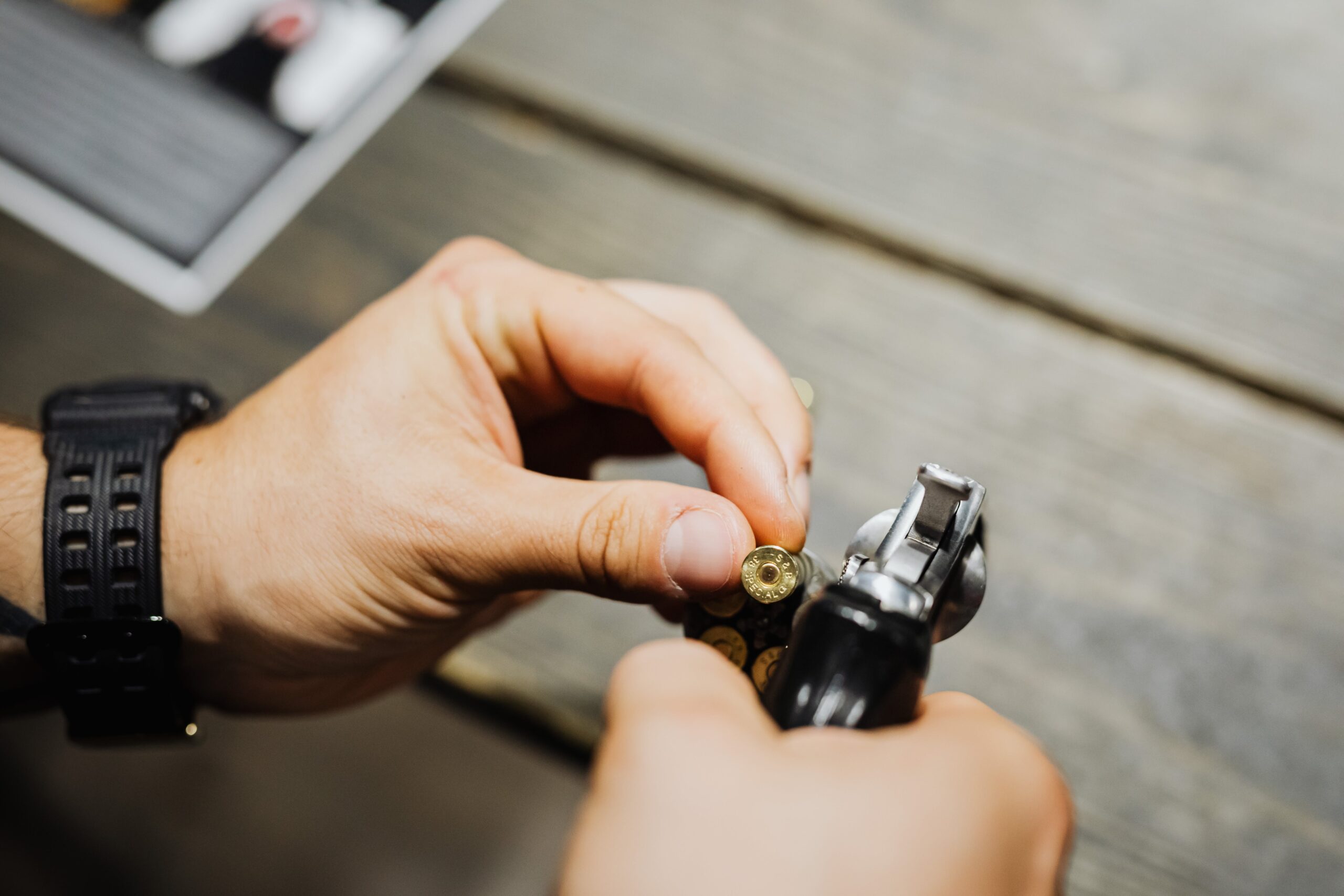 Person loading a revolver