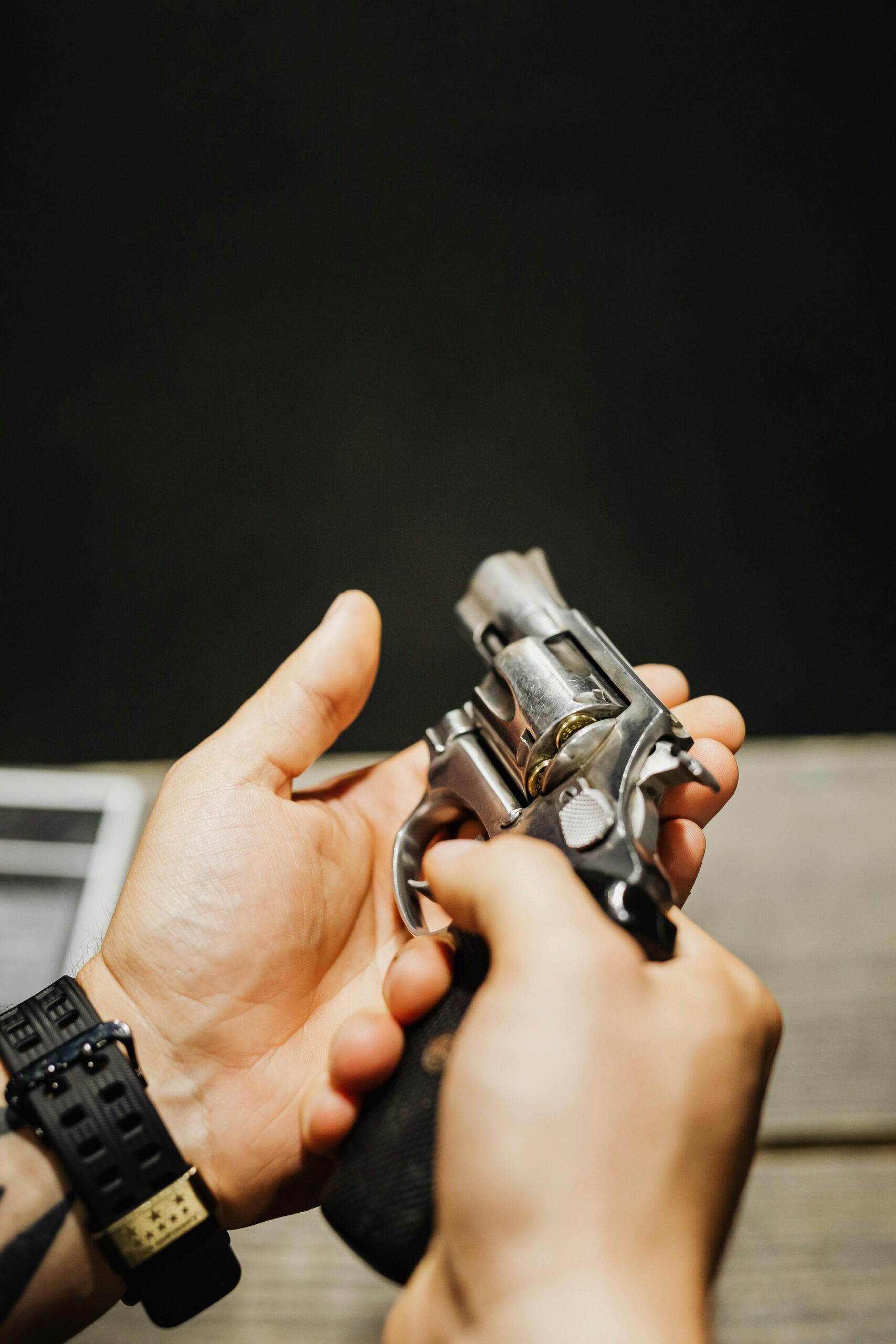 Person holding a revolver